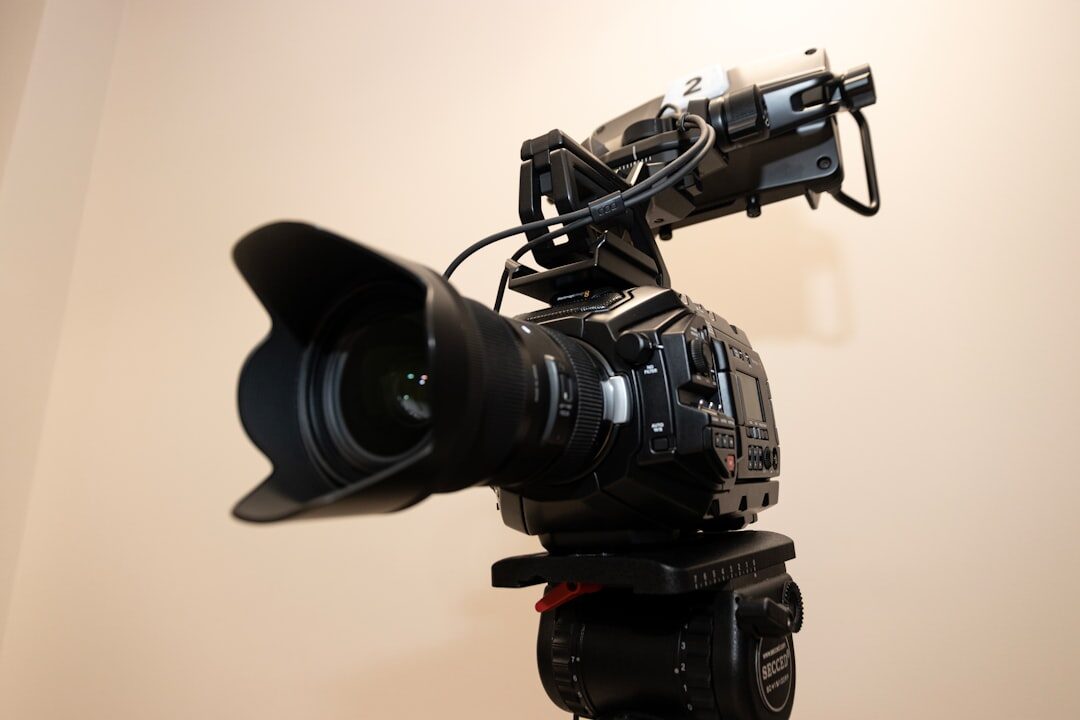 Professional camera and lens on a tripod in a studio